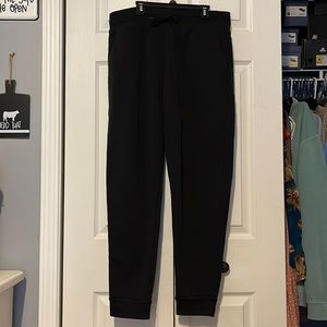 Black sweatpants. With pockets.